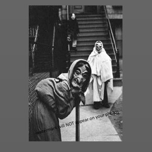 May include: Black and white photo of three people dressed in costumes for Halloween. A person wearing a witch costume with a pointed hat and a mask is standing in the foreground. A person wearing a white sheet costume with a mask is standing in the background. A person wearing a dark coat is standing in the background.