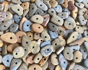 50x small (1/2”- 1”inch) flat, smooth stones with middle drilled holes (~3mm)