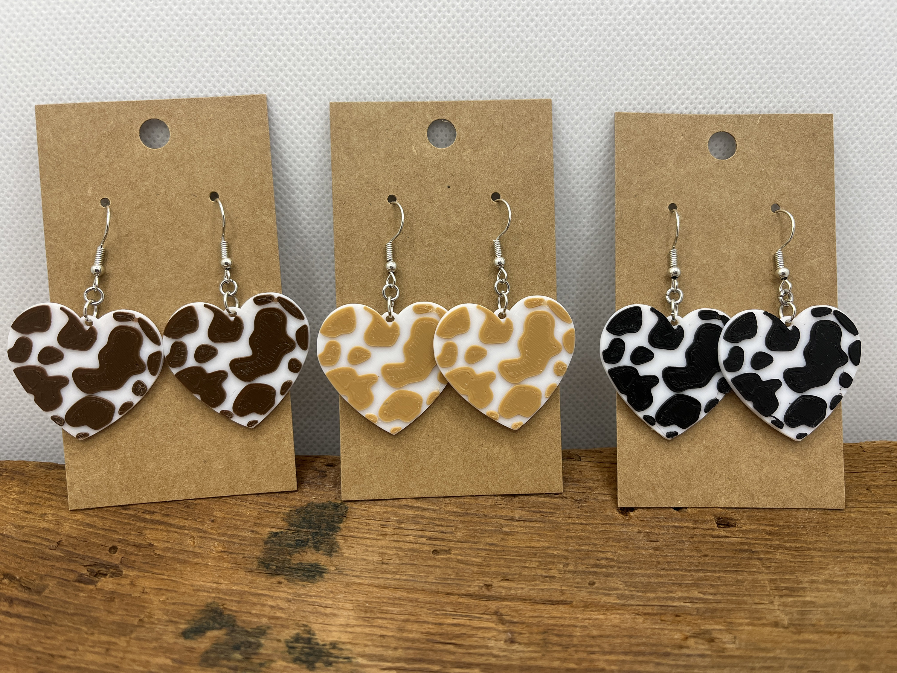 Cow print heart earrings deals