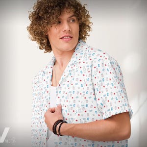 May include: A white short-sleeved button-down shirt with a blue and red pattern of small bottles and stars. The shirt has a collar and a relaxed fit.