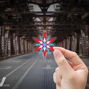 May include: A multi-pointed star design in red, white, and blue is held in front of a bridge. The star has a transparent background. The word "VISIBLY VECTOR" is printed in the lower left corner.