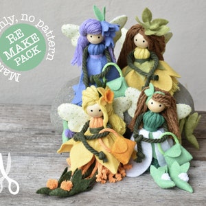 Può includere: Quattro bambole di fata in feltro con gonne e ali a forma di fiore. Le fate indossano colori diversi, tra cui viola, giallo, verde e marrone. Le bambole sono sedute su una roccia con il testo "Materials only, no pattern RE MAKE PACK" in un cerchio.