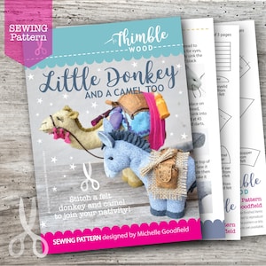 May include: A sewing pattern titled "Little Donkey and a Camel Too" with illustrations of felt donkey and camel figures. The cover is light blue with the text "Thimble Wood" and "Sewing Pattern" in pink. Includes instructions.