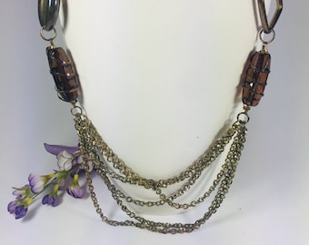 Long brass chain necklace with large brown glass beads