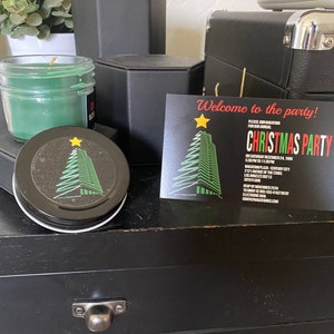 May include: A black and green Christmas party invitation with a stylized Christmas tree and the text "Welcome to the party!" and "Christmas Party".