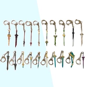 May include: A set of 20 colourful sword keychains. The keychains are made of metal and feature different designs, including swords, daggers, and spears. The keychains are all attached to silver key rings.
