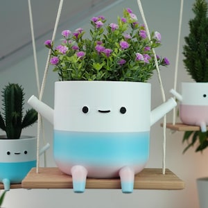 Pot de fleurs dégradé rose bonbon sur mini-balançoire | Support pour plante suspendue avec cordon macramé