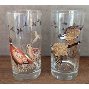 May include: A handmade wooden sign with the text "Welcome" in a playful font. The sign features a distressed white background and a dark brown frame, perfect for a front door or entryway. The sign measures approximately 12 inches wide.