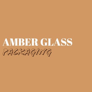 May include: An image with the words "AMBER GLASS PACKAGING" in white and brown text on a solid tan background. The text is centered and takes up the bottom third of the image.
