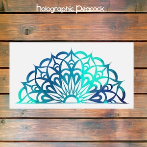May include: A teal and blue mandala design with a white background. The mandala is a half circle with intricate details.