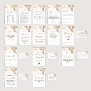 May include: A set of printable baby shower game cards featuring a hot air balloon theme with gold and white accents. The cards include games like "Say Baby Around the World", "Guess the Sweet Mess", "Guess the Baby Food", "Guess How Many Gummy Bears Are in the Jar", and "How Big is Mommy's Belly".