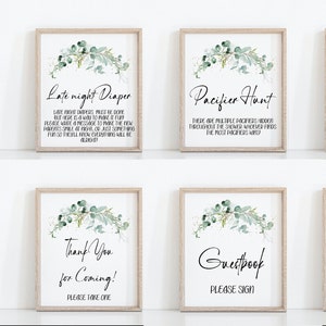 May include: Eight printable signs with a eucalyptus theme for a baby shower. The signs include: "Babies are Sweet", "Late Night Diaper", "Pacifier Hunt", "Don't Say Baby", "Taco Bar", "Thank You for Coming", "Guestbook", and "Photo Booth".