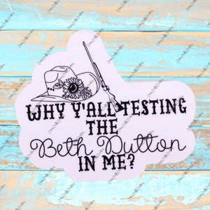May include: Black and white graphic design with a cowboy hat, a gun, and the text "Why y'all testing the Beth Dutton in me?"