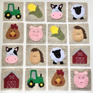 May include: A collection of sixteen felt squares, each featuring a different farm-themed design. The designs include a green tractor, a yellow corn, a cow, a sheep, a chicken, a pig, a horse, and a red barn. The squares are arranged in a grid pattern.