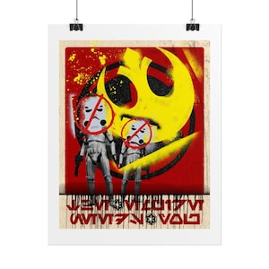 May include: A poster with two Stormtroopers, each with a red 'no' symbol over their helmets, set against a red backdrop with yellow spray paint effects. A yellow and black symbol is in the background. The poster has text at the bottom.