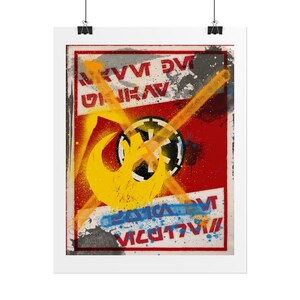 May include: A framed poster with a graffiti-style design. The poster has a red background with yellow and orange spray paint accents. A yellow crescent moon and a black and white circular emblem are prominent. Text is visible in white and blue.