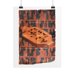 May include: An abstract art print featuring a geometric design in shades of orange and black. The artwork has a distressed, vintage aesthetic, with a central architectural form and overlaid text elements. The print is mounted on white paper and held by black clips.