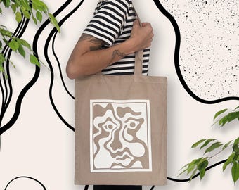 Unik handfärgad screentryckt shoppingväska i ekologisk canvas med konsttryck av ansikte