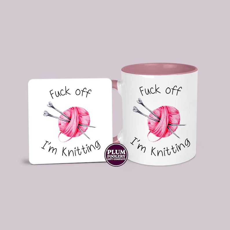 11oz ceramic mug in white with pink accents and an optional white MDF matching coaster. It has the words “Fuck off I’m knitting” with an illustration of a pink ball of yarn with knitting needles. mug is microwave & dishwasher safe.
