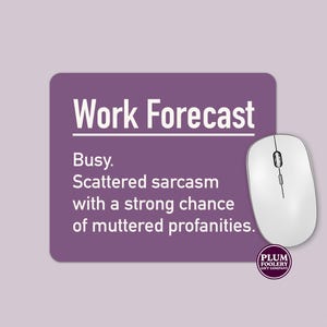 May include: Purple mouse mat with the text "Work Forecast" and the text "Busy. Scattered sarcasm with a strong chance of muttered profanities." The mouse mat is next to a white computer mouse.