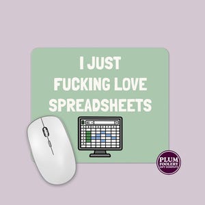 May include: A white computer mouse beside a rectangular mousepad. The mousepad has the text "I JUST FUCKING LOVE SPREADSHEETS" in white on a light green background, with a spreadsheet graphic.