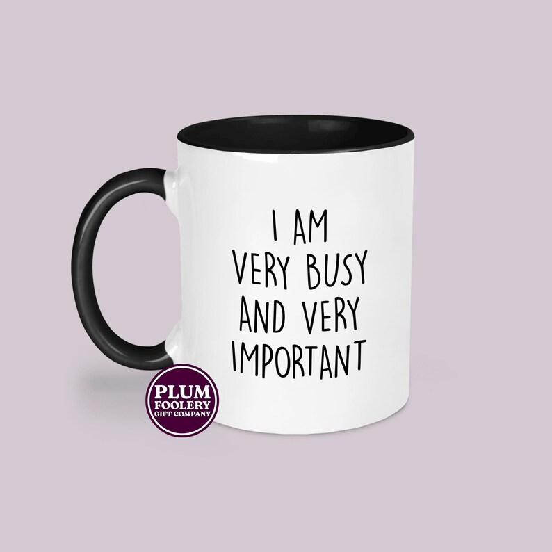 Black handled sarcastic work mug with funny office slogan