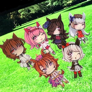 May include: A collection of seven anime-style character cutouts, each with unique hairstyles, outfits, and accessories. The characters are depicted with large eyes and are set against a green grassy background.