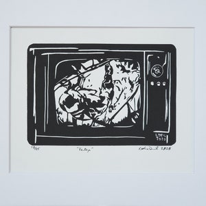 Vertex - A linocut relief print by Artist Leslie Deil of a television showing the first moon landing with black ink on white paper. Captures the moment Neil Armstrong descended to the surface of the moon.