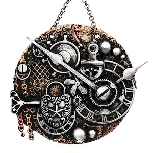 May include: A silver and gold steampunk-style clock face with intricate gears, chains, and a keyhole. The clock face is surrounded by a brown, textured frame.
