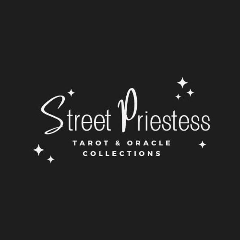 May include: White text on a black background reads "Street Priestess Tarot & Oracle Collections" with stars surrounding the text.