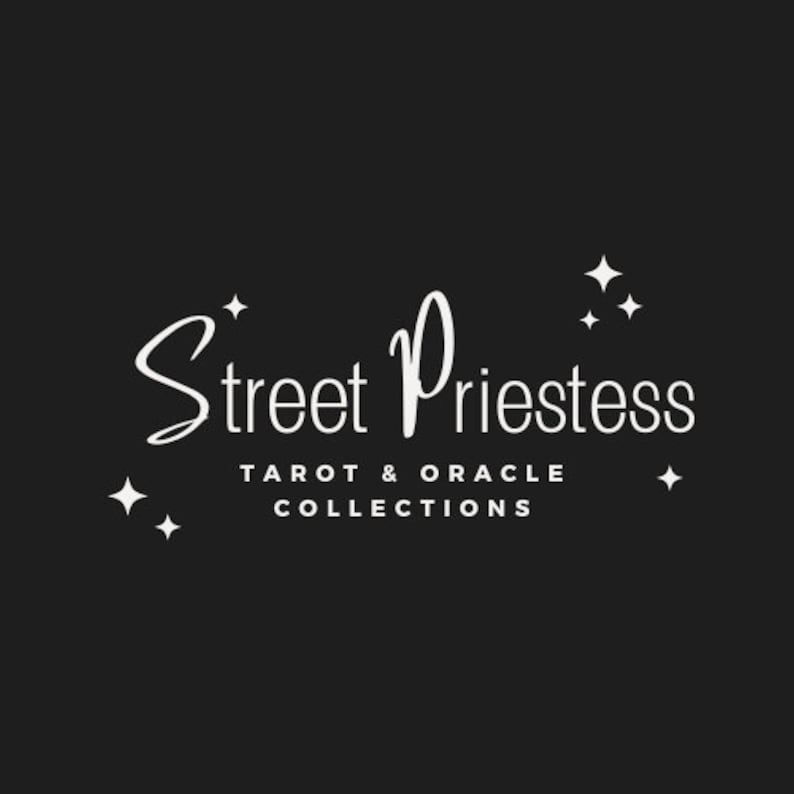 May include: White text on a black background reads "Street Priestess Tarot & Oracle Collections" with a stylized font and stars surrounding the text.