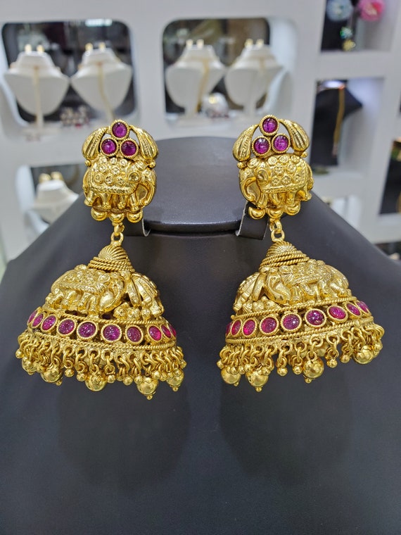 Gold big jhumka earrings deals