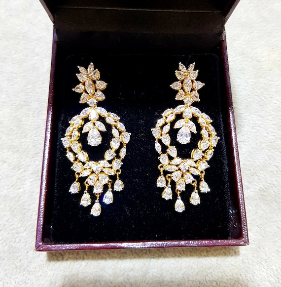dc jewels Gorgeous Asymmetrical Silver Metal Star Moon Silver Swarovski  Zirconia Drop Earrings for Women : Amazon.in: Fashion