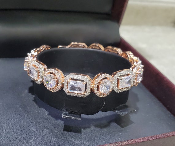 Sold at Auction: 14ct Yellow Gold 7.63ct Diamond Bangle. Fifty Eight Round  Brilliant Cut Diamonds. Comes With a Certificate of Valuation of $75,000.  Inner Bangle Measures 55mm in Diameter. Free Express Delivery