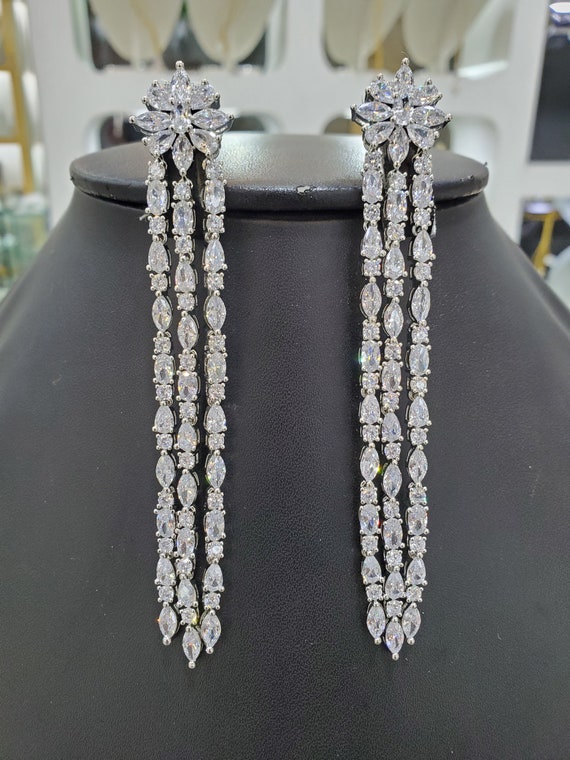 Long silver deals diamond earrings
