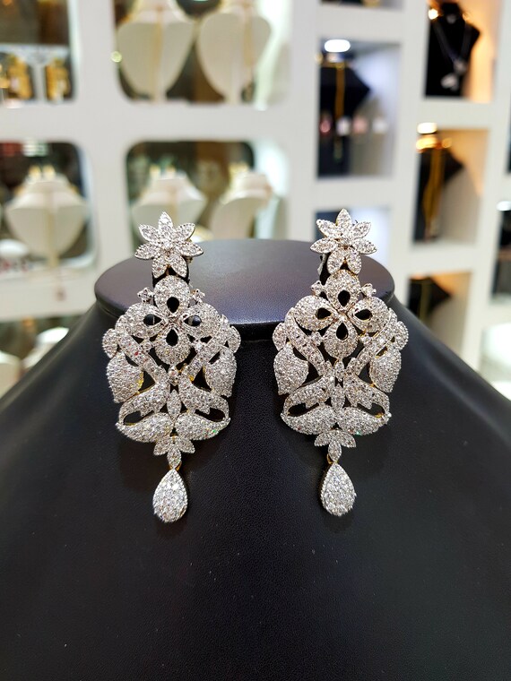 SILVER PLATED DIAMOND LOOK SIGNITY STUDDED EARRINGS – Sanvi Jewels