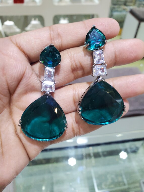 Green diamond best sale earrings