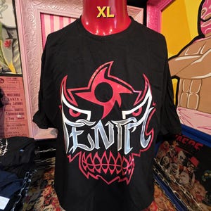 May include: Black XL t-shirt with a red and white graphic design. The design features a stylized skull with the word "ENTL" in white and silver lettering. The shirt is displayed on a red mannequin.