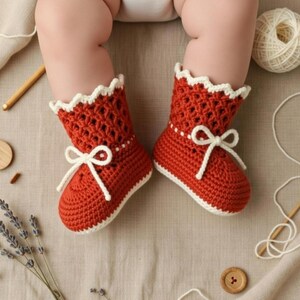 Crochet baby boot sole measuring approximately 10 cm for a 9 to 12 month baby size.
