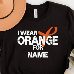 I wear orange for name, Leukemia Cancer Awareness Shirt, Leukemia Awareness, Personalization, Orange Ribbon Shirt, Stronger Than Cancer,