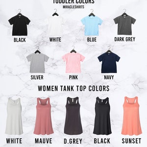 May include: A chart showing toddler and women's tank top colors. The toddler colors are black, white, blue, dark grey, silver, pink, and navy. The women's tank top colors are white, mauve, dark grey, black, and sunset.