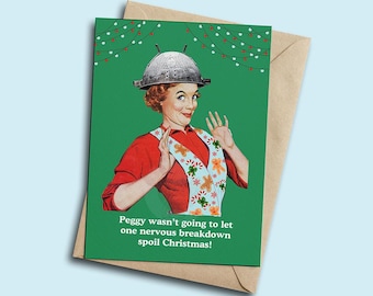 May include: A humorous Christmas card featuring a woman wearing a colander on her head and a festive apron. The text reads "Peggy wasn't going to let one nervous breakdown spoil Christmas!"