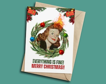 May include: A Christmas card featuring a vintage illustration of a woman with flames above her head, surrounded by a wreath with ornaments. The card reads "EVERYTHING IS FINE! MERRY CHRISTMAS!!" in red and white text.