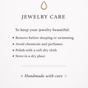 May include: A white informational card titled JEWELRY CARE with a gold droplet icon. It lists instructions: remove before sleeping or swimming, avoid chemicals and perfumes, polish with a soft dry cloth, and store in a dry place. Ends with Handmade with care.