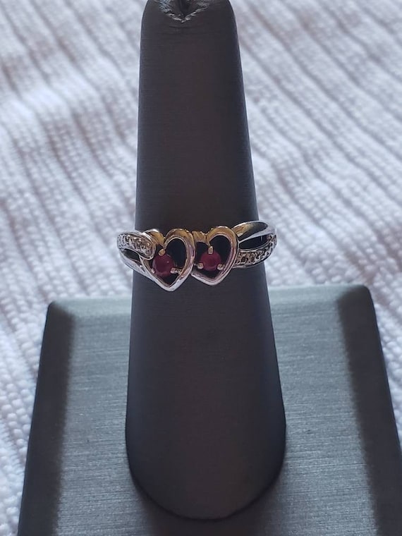Double heart lab created Ruby ring in Silver. Thi… - image 1