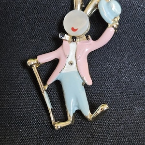 1960s Bunny in Top Hat Scatter Pin. This Little Bunny has a top hat and cane. Mother of Pearl face with red lips. Enamel loss on hat