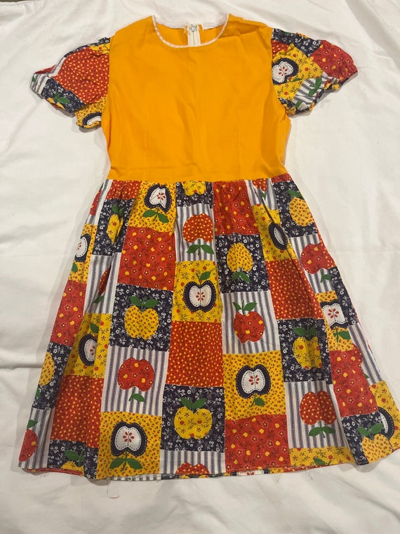 Girls hand sewn 1970s patchwork dress with apples