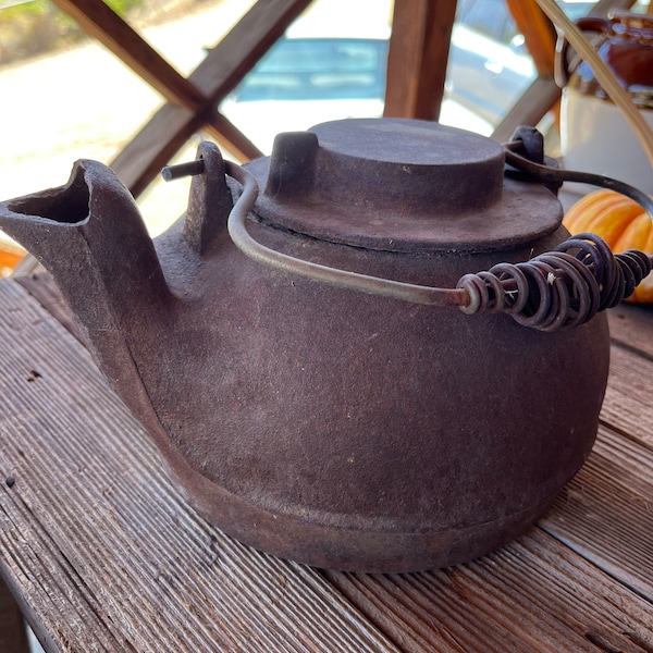 Vintage cast iron rusty kettle