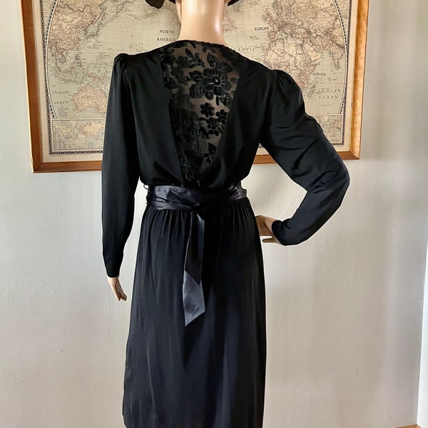 Vintage black wrap dress with deep v front and lace cut away back