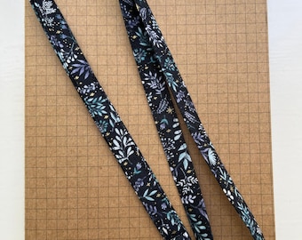 Charmed flora black with gold metallic fabric skinny lanyard
